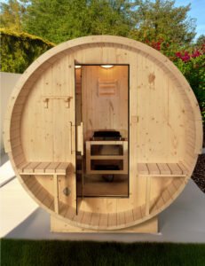 Authentic Finnish pine barrel sauna in garden setting   traditional Nordic wellness design with natural wood craftsmanship