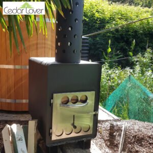 Wood fired stove next to hot tub surrounded by green plants
