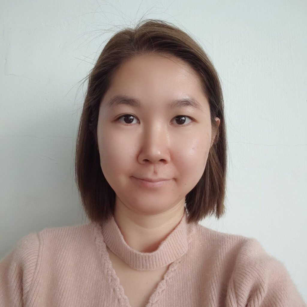 Short haired woman smiling radiating happiness