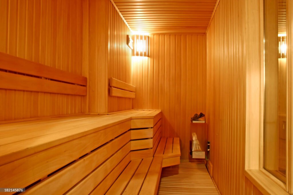 2 Cedar Lover A cozy sauna with neat wooden panels and benches